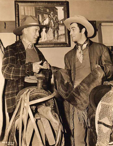 During the making of MGM’s “Billy the Kid” in 1941, William S. Hart gives Robert Taylor a little advice about a pair of chaps. (Thanx to Bobby Copeland.)