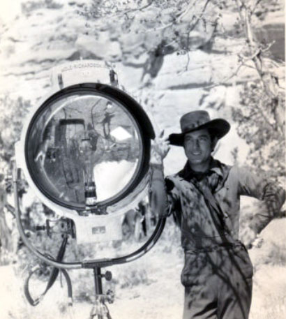 Johnny Mack Brown stands next to a production light while making “Billy the Kid” in 1930. (Thanx to Jerry Whittington.)