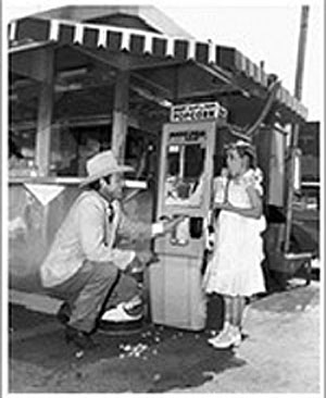 Allan "Rocky" Lane shares some popcorn with Roy and Dale's daughter Cheryl Rogers. (Thanx to Carmen Sacchetti.)