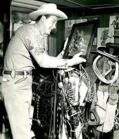 Monte Hale looks at a painting of a horse. Taken in the Republic prop room? (Thanx to Jerry Whittington.) 