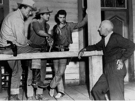 Director Howard Hawks explains a “Rio Bravo” (‘59) scene to John Wayne, Dean Martin and Ricky Nelson. (Thanx to Jerry Whittington.)