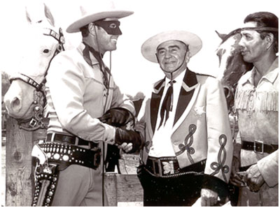 Clayton Moore, Sheriff Eugene Biscailuz, Jay Silverheels at an annual L.A. Sheriff’s Rodeo. Note Clayton is wearing the large mask and dark trousers. Silver has no spot in his ear indicating it is the original horse. Also note Clayton’s open holster...previously worn by Brace Beemer. (Thanx to Carmen Sacchetti.)
