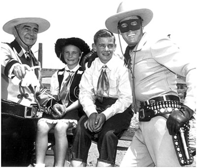 Sheriff Eugene Biscailuz, Joan and William Mohr, Clayton Moore at a Sheriff’s Championship Rodeo in L.A. Coliseum.