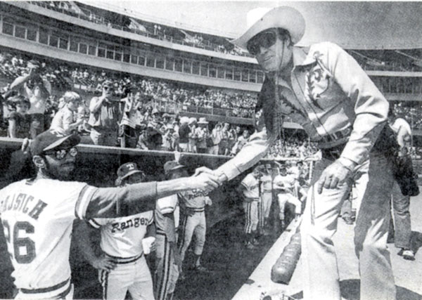 Wearing sunglasses, Clayton Moore appeared at Texas Rangers games for several years.