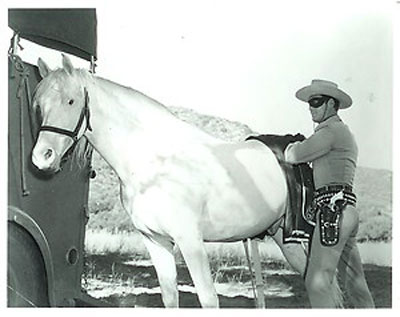 The Lone Ranger prepares to saddle Silver.
