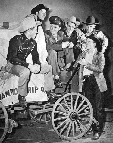 One year, during Gene's time in the service, he was granted a ten day furlough and spent it in New York at the Madison Square Gardens rodeo which that year starred Roy Rogers. Here Sgt. Autry talks with a group of the Garden cowboys.