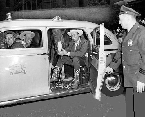 Gene and Champ arrive by cab for a rodeo performance. (Thanx to Jerry Whittington.)