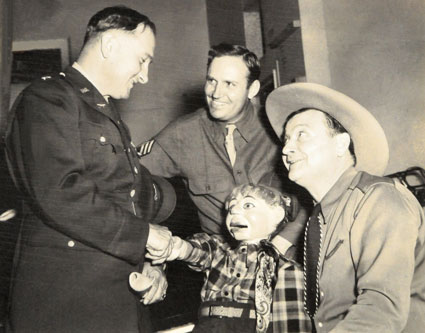 T/Sgt. Gene Autry introduces his friends Max Terhune and Elmer to one of Gene's officers in 1942.