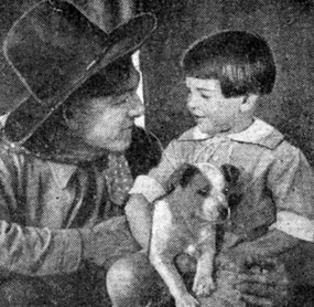Harry Carey tells a young boy a wild west story in 1920.