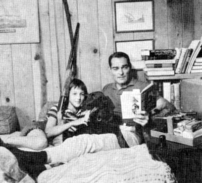 At home, John Russell reads to daughter Renata Amy Russell, age 12. The dog’s name is Jezabel. Circa 1959.
