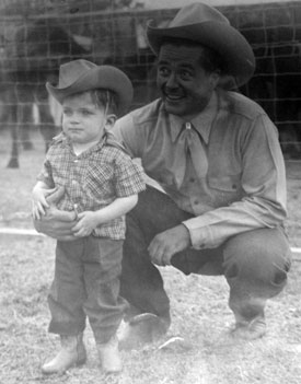 Tim Holt in 1949 with a young Mike Shoulders, son of Marvin Shoulders who was the brother of rodeo star Jim Shoulders.