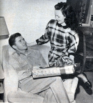 Christmas, 1948. Wanda Hendrix presents Audie Murphy’s Christmas gift. The couple were married on February 8, 1949.