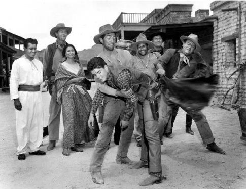Dean Martin, John Wayne and others celebrate Ricky Nelson’s 19th birthday on the set of “Rio Bravo” in 1959.
