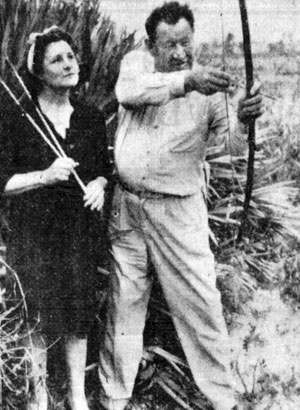Famous Indian sports figure and actor Jim Thorpe with his wife Patricia practicing with bow and arrow in Miami, Florida, in January 1946.