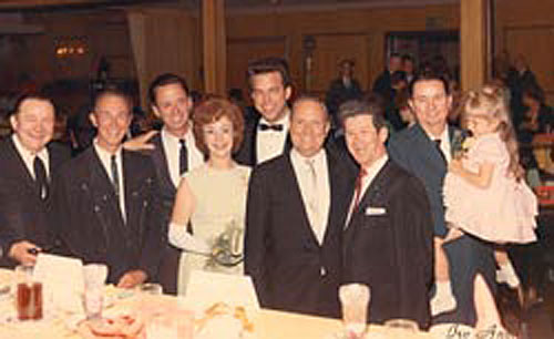 A nice gathering for Tex Ritter and Dorothy Fay’s 25th wedding anniversary celebration in 1966. (L-R) Tex Ritter, Eddie Dean, Joe and Rose Lee Maphis, unknown, Gene Autry, Roy Acuff, Johnny Bond and Heather Moore.
