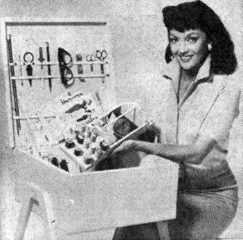 Mari Blanchard demontrates a handy chest for holding sewing articles. When closed it serves as a small seat.