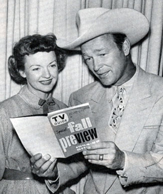 Roy Rogers and Dale Evans check out their TV series listings in the 1954 Fall preview edition of TV GUIDE.