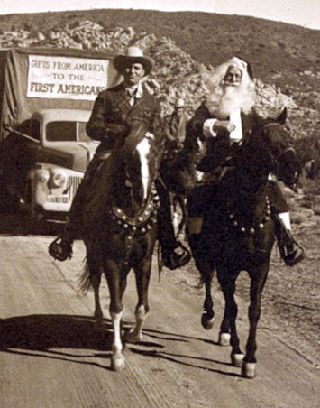 Gene Autry rides a 1949 Christmas trail with Santa Claus.