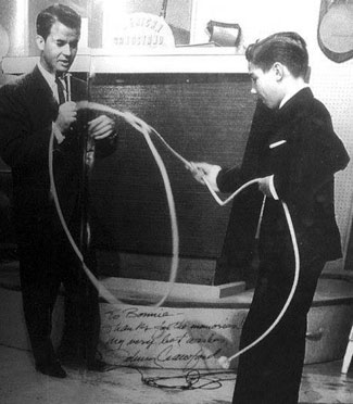 Johnny Crawford demonstrates the art of rope twirling to Dick Clark on “American Bandstand”.
