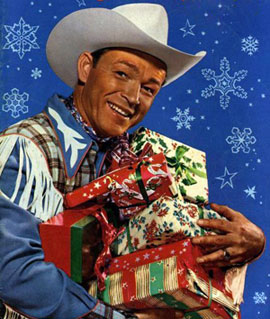 Roy Rogers holding Christmas gifts.