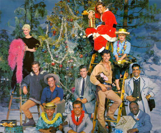 The photo cover to the 1959 Warner Bros.’ “We Wish You a Merry Christmas” LP. (L-R: bottom row) Poncie Ponce and Robert Conrad of “Hawaiian Eye”, Eddie Cole of “Bourbon Street Beat” (middle row) Roger Moore of “The Alaskans”, Ty Hardin of “Bronco”, Efrem Zimbalist Jr. of “77 Sunset Strip”, Peter Brown of “Lawman”, Ray Danton of “The Alaskans” (top row) Dorothy Provine of “The Alaskans”, Edward Byrnes of “77 Sunset Strip”, Connie Stevens of “Hawaiian Eye”. Each star sang one of the 14 songs on the LP and all joined in for “We Wish You a Merry Christmas”.