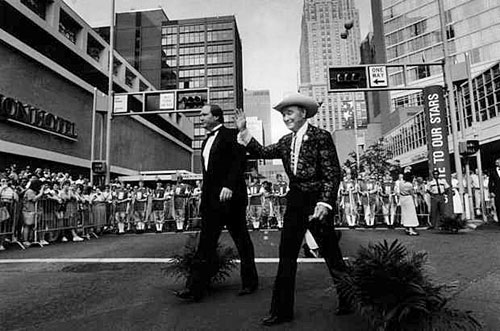 Roy walks with his son Dusty down the red carpet on their way to the Salute To Our Stars gala at the Cincinnati, OH, bi-centennial on July 9, 1988.