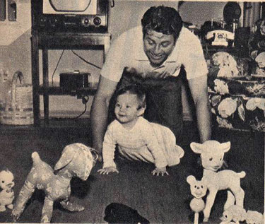 Jim Davis in 1953 plays with his daughter Tara Diane. His daughter died tragically in a car crash at 17 in 1970.