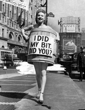 Pretty Penny Edwards dons a barrel to help encourage clothing donations for the National Clothing Collection, a relief effort to aid the destitute in war-torn Europe in 1949.