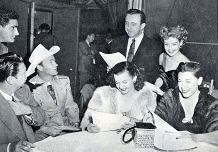 Donating their time to the National Safety Council at L.A.’s Ambassador Hotel in early 1951 are (L-R) NBC’s Warren Lewis (standing), Harry Von Zell, Roy Rogers, Dale Evans, Frank De Vol, Gloria De Haven and Judy Canova.