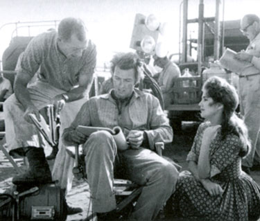 Director Ted Post goes over a “Rawhide” scene with Clint Eastwood. Actress is unknown.