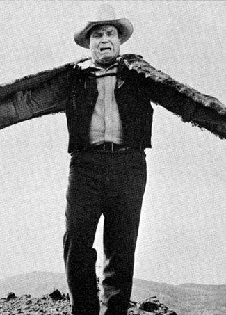 Dan Blocker as Hoss Cartwright tries on a pair of wings in the “Bonanza” episode “Ponderosa Bird Man” (2/7/65).