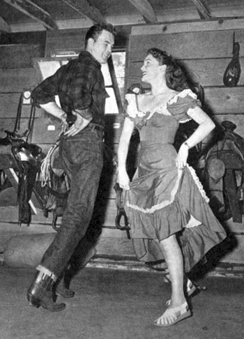 Scott Brady and Joan Leslie brush up on their do-si-dos while square dancing in December ‘49.
