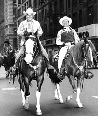 Gene Autry with his rodeo producer (1942-1959) partner Everett Colburn riding in a New York City parade.
