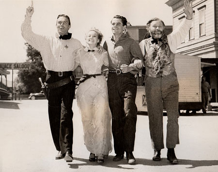 On the Columbia backlot with Randolph Scott, Claire Trevor, Glenn Ford and Edgar Buchanan while filming “The Desperadoes” (‘43).