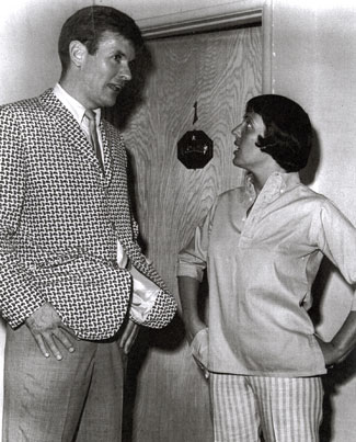 Keely Smith seems to saying to Will “Sugarfoot” Hutchins, “Where did you get that jacket?” Will said, “Same place you got those pants.”