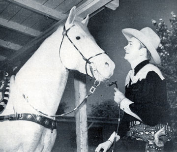 Tex Ritter and his great horse White Flash.