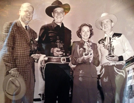 In 1947 Columbia released Charles Starrett’s “Stranger from Ponca City”. This photo was taken when Starrett and others appeared in Ponca City, Oklahoma, for the screening of the film at the old Center Theatre. (L-R) Unknown, Starrett, leading lady Virginia Hunter and Roscoe Ates. It’s odd Ates was there as he has no role in the film and wasn’t really associated with Columbia Pictures. However, Smiley Burnette was there for the film but is not in this photo. Each of the four above are holding a scale model of the very famous Pioneer Woman statue which is in Ponca City. (www.okhistory.org/sites/pioneerwoman.php) Recently (10/18/15), I was in Ponca City, attended and spoke briefly before a special screening of “Stranger from Ponca City” at the Poncan Theatre along with Oklahoma Balladeer Les Gilliam and old friend Grant Hodges.