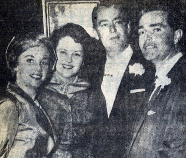 Carol Lee Ladd (left), daughter of Mr. and Mrs. Alan Ladd (center), and Warner Bros. executive John Veitch upon their marriage at the Little Brown Church of the Valley in Hollywood. (2/10/58 UP Telephoto).