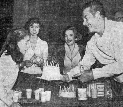 “Dodge City”, “Rocky Mountain”, etc. Western star Errol Flynn presents a cake to Claudia Crawford on her 11th birthday in February ‘58. Looking on at the back stage party are Jan Brooks, Avis Scott. The company was getting ready to move to Detroit for the premiere of the play based on the novel JANE EYRE.