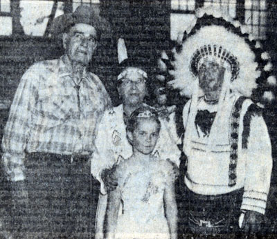 Jack Hoxie appearing on a program at the Derby Stay At Home Camp in North Carolina with (L-R) Galloping Horse (Mrs. Mary Reed), her husband Chief Running Horse (Daniel Reed), and their granddaughter Linda Daniels. Reed’s were members of the Cherokee Nation.