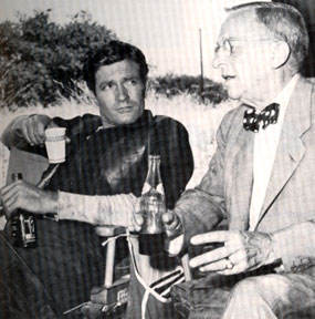 TV’s “Wyatt Earp”, Hugh O'Brian, relaxes on the set with Stuart Lake, consultant to the ABC series, who knew the real Earp and gathered material for his book WYATT EARP, FRONTIER MARSHAL.