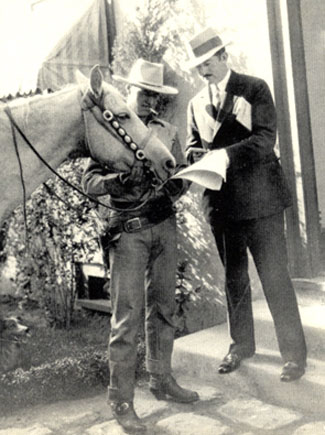 Jack Holt and director John Waters. Possibly taken during the filming of “Man of the Forest” in 1926.