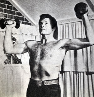 For the gals...Robert Horton of “Wagon Train” warms up with his barbells.