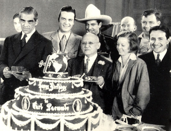 Attending Universal founder Karl Laemmle’s 67th birthday on January 17, 1934 are (L-R) Boris Karloff, Hugh Enfield (aka Craig Reynolds), Ken Maynard, Laemmle (in front of Maynard), Margaret Sullivan, Vince Barnette, Andy Devine and Karl Laemmle Jr.