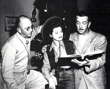 Director John English (right) goes over a script with Gail Davis and Republic  cameraman Bill Bradford.