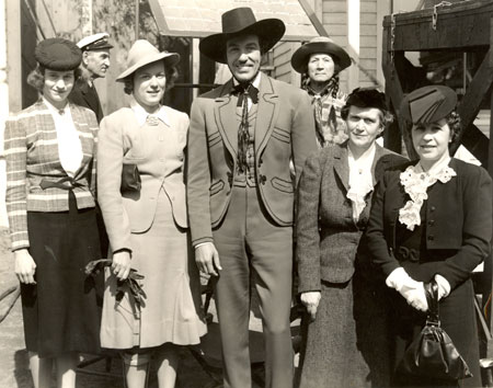 Cesar Romero as the Cisco Kid poses with a group of ladies in 1940.