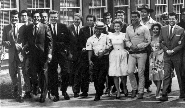 (L-R) Roger Moore, Ray Danton (?), Lee Patterson, unknown, Donald May, Gary Vinson, Effrem Zimbalist Jr., Poncie Ponce, Robert Logan, Connie Stevens, Sammy Jackson, Peter Brown, Clint Walker, Margarita Sierra, Will Hutchins, unknown.