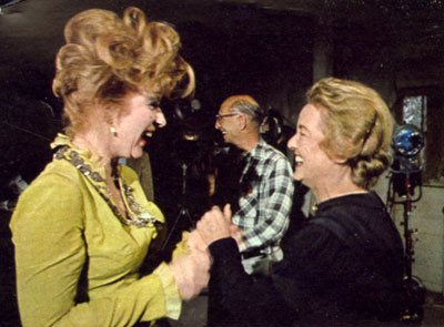 Amanda Blake as Miss Kitty and “Gunsmoke” guest star Bette Davis share a laugh after a tough scene filming “The Jailer” episode in 1966.