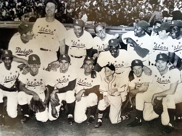 A combination of TV cowboys, singers, sports stars and actors at the 1962 Hollywood Stars baseball game at L.A. Dodger stadium. Top Row (L-R): Dean Martin, Chuck Connors, Joe Louis, Phil Silvers, Nat King Cole, Archie Moore, Pat Boone, Rafer Johnson. Bottom Row (L-R): Johnny Mathis, Peter Brown, Michael Dante, John Beradino, Jay North, Jack Warden, Max Baer Jr. (Thanx to John Bickler.)