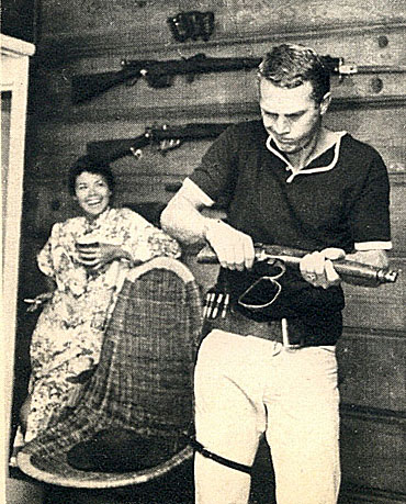 Steve McQueen learns how to handle his Mare’s Laig for his new “Wanted Dead or Alive” series as wife Neile Adams laughs in the background.